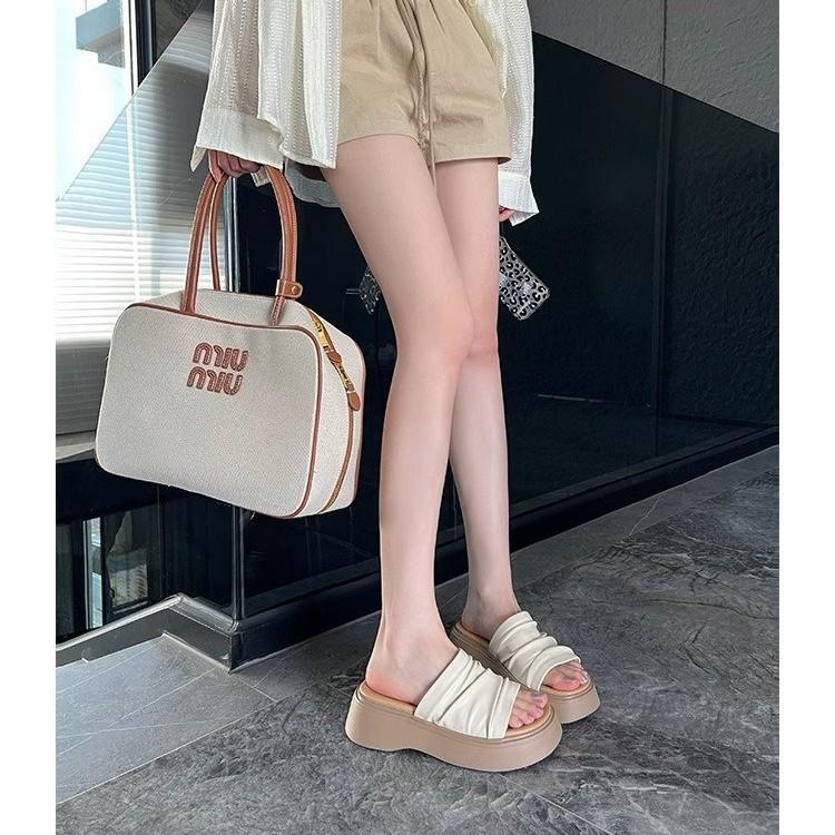 Thick-soled heightened wrinkled leather one-word slippers women's summer 2025 new wear soft leather sandals, comfortable and versatile