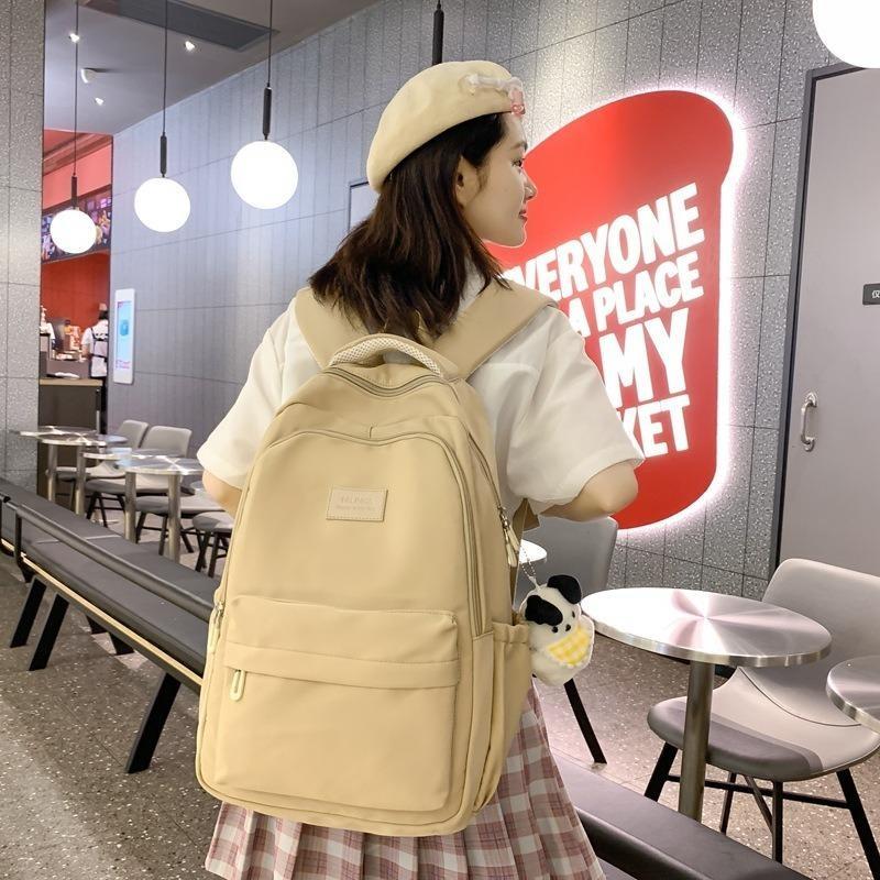 Solid color female Harajuku backpack, campus style, junior high school, high school student schoolbag, female simple large-capacity backpack
