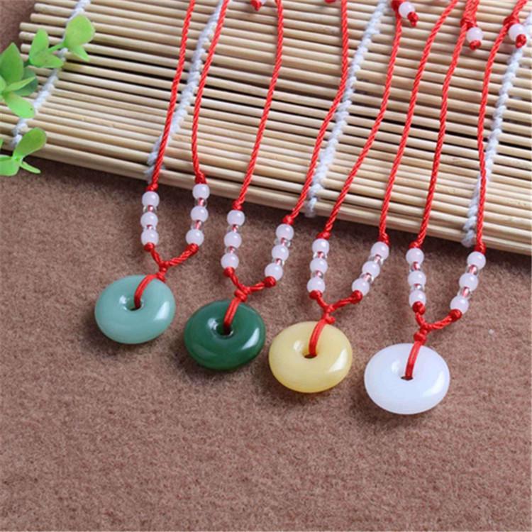 Hetian Jade Guanyin Buddha Pendant Necklace with Red String and Eight Bead Design.