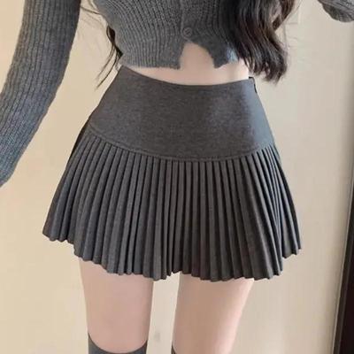 Saia plissada de lã feminina coreana fofa e sexy de cintura alta em formato A, minissaia ousada para outono e inverno, estilo vintage escolar.