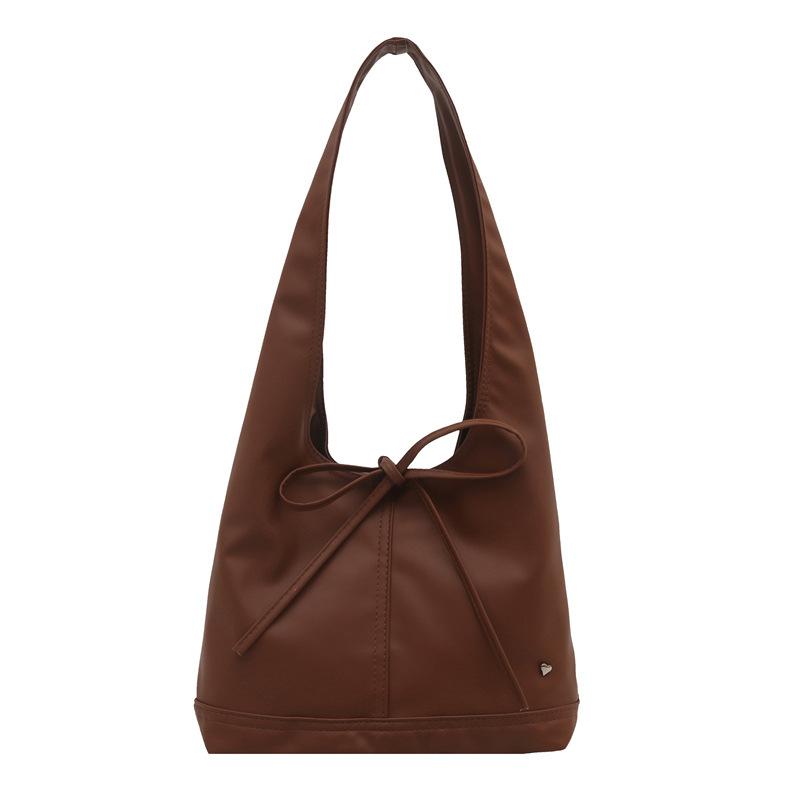 

Korean version of niche oil wax leather commuter women s bag, versatile casual French bow, large capacity one-shoulder armpit tote bag коричневый