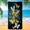 A women's oversized beach towel that is soft quick-drying and super absorbent with a beautiful butterfly and flower design