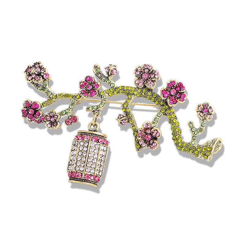 

Vintage Rhinestone Plum Blossom Brooch: Women s Floral Lantern Corsage Accessory