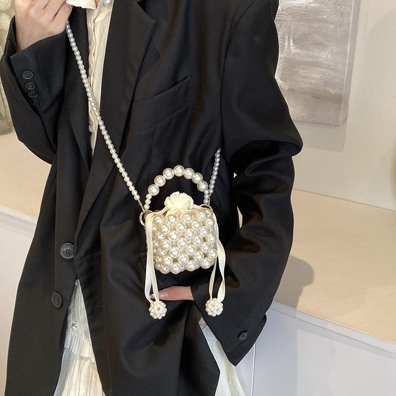 Daily commute imitation pearl woven hollow mini women lipstick earphone bag spring new shoulder messenger bag