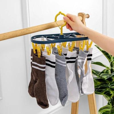 Space-Saving Plastic and Metal Clothes Drying Rack with 12 Windproof, Non-Slip Clips for Socks and Underwear