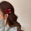 Red Velvet Bow-shaped Golden-label Hairpin As A New Year Hair Accessory for The Side of A Young Girl's Hair