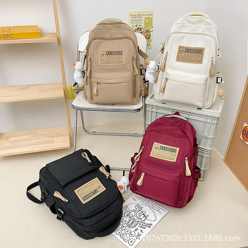 Schoolbag student schoolbag junior high school campus large capacity backpack wholesale simple multi-layer leisure travel computer bag