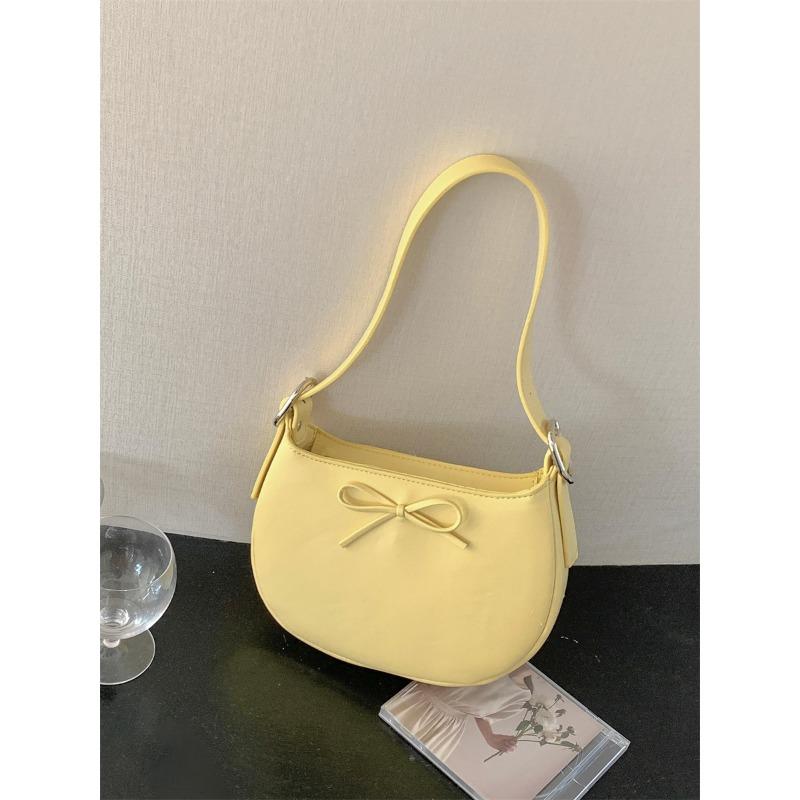 

Niche style underarm bag women s oval simple small handbag fashion bow spring and summer new shoulder bag women жёлтый