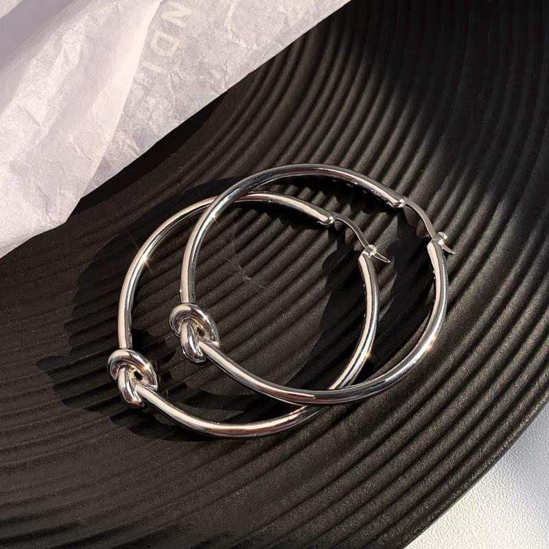 European & American Silver Knot Large Hoop Earrings for Women - High-End Gold Ear Cuffs with Unique, Elegant Design.
