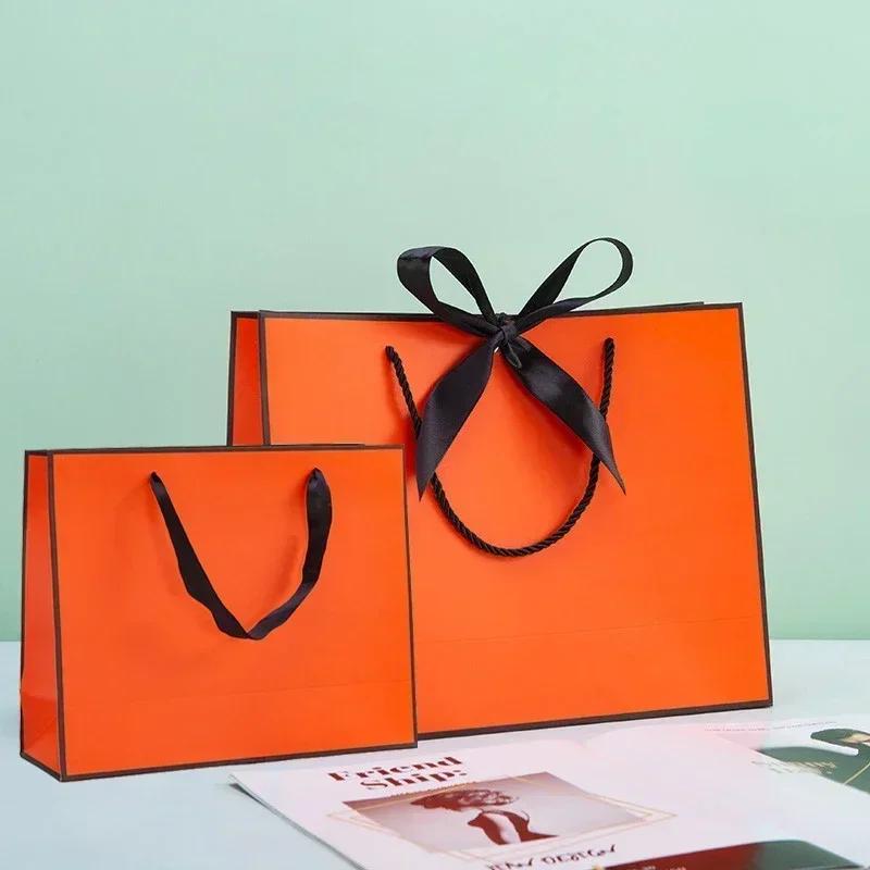 White Paper Jam Handbag Kraft Paper Thick Waterproof Frame Rivet Handle Gift Bag Cosmetic Clothing Store Portable Packaging Bags
