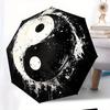 Automatic Folding Umbrella Yin-yang symbol with paint splatter effect. Portable collapsible design, casual outdoor accessory,