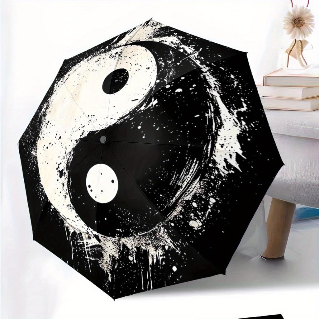 Automatic Folding Umbrella Yin-yang symbol with paint splatter effect. Portable collapsible design, casual outdoor accessory,