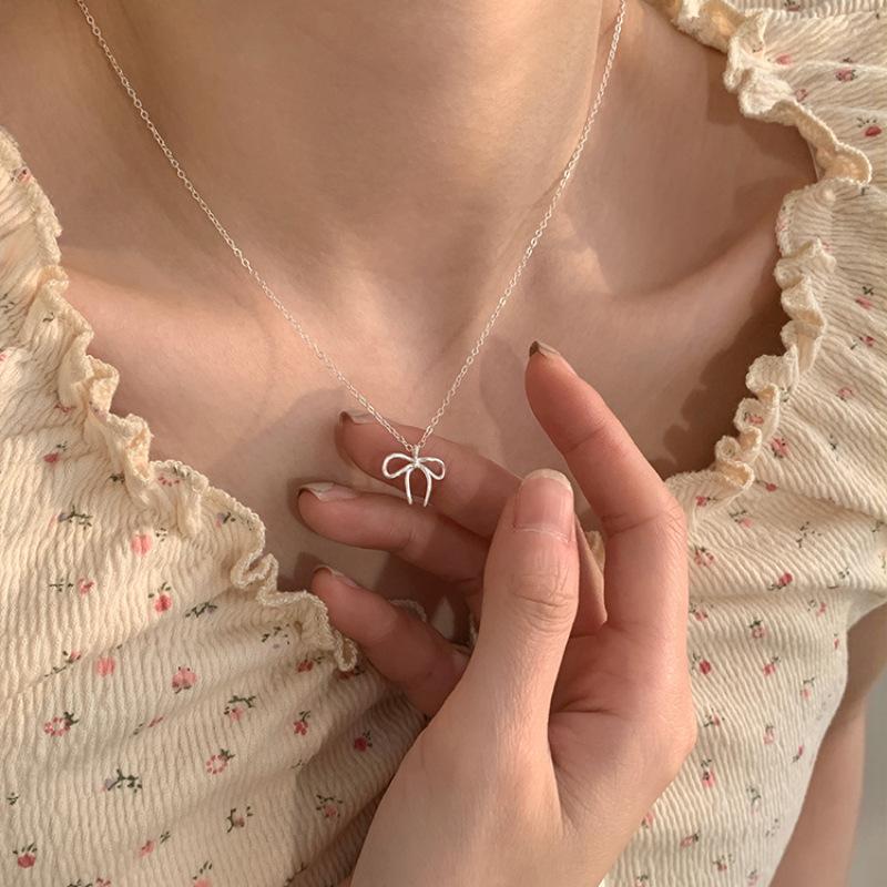 

PANJBJ Silver Color Bowknot Necklace for Women Girl Hollowing Out Extremely Fine Versatile Sweet Jewelry Gift Dropshipping