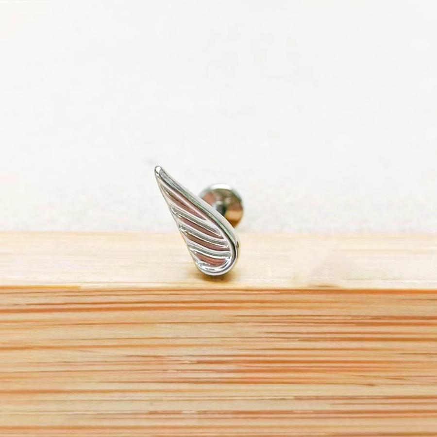 

Пирсинг для губы из титанового сплава F136 в корейском стиле, с подвеской в виде цветка и крыла из циркония 5A, калибр 1,2, конус зуба 0,9. 6mm