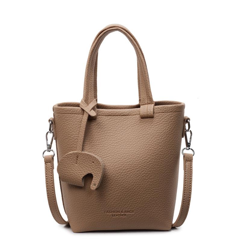 Niche casual vegetable basket bag women's new solid color bucket bag simple hand bag shoulder messenger bag