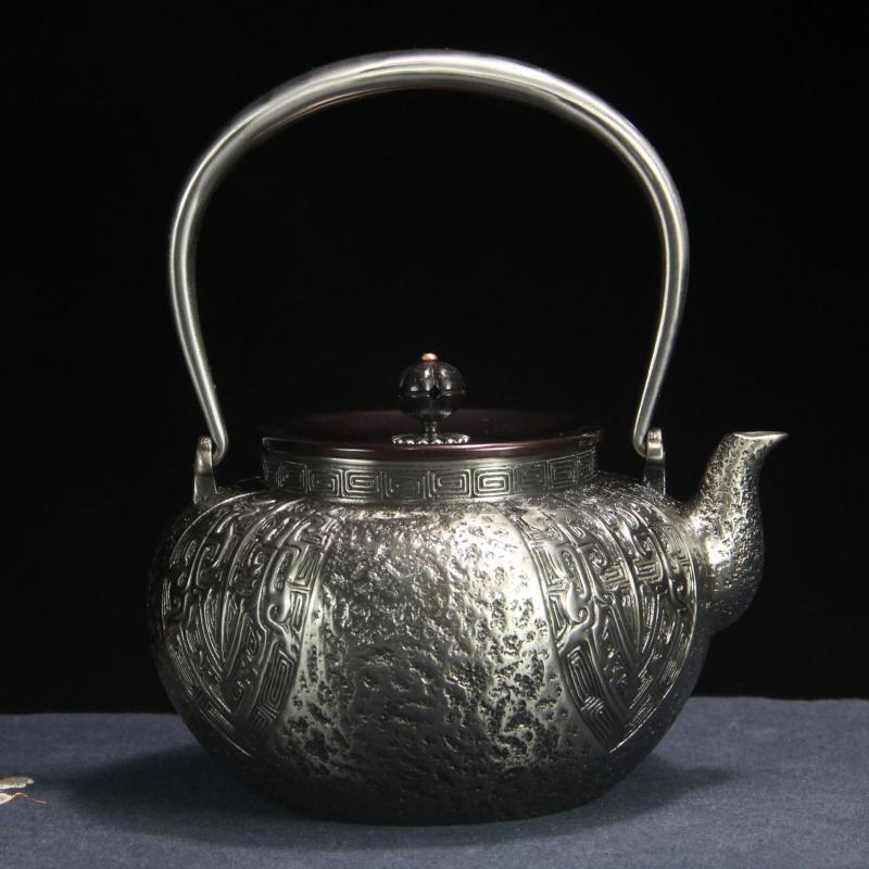 Handmade Sand Iron Teapot with Beast Face Pattern
