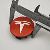 Samolepka na auto 2025 Nové Tesla 4ks ABS 56mm Kryty odznaků Tesla Model 3 Model Y Krytky nábojů Středové krytky kol pro Tesla Model Y X S 202