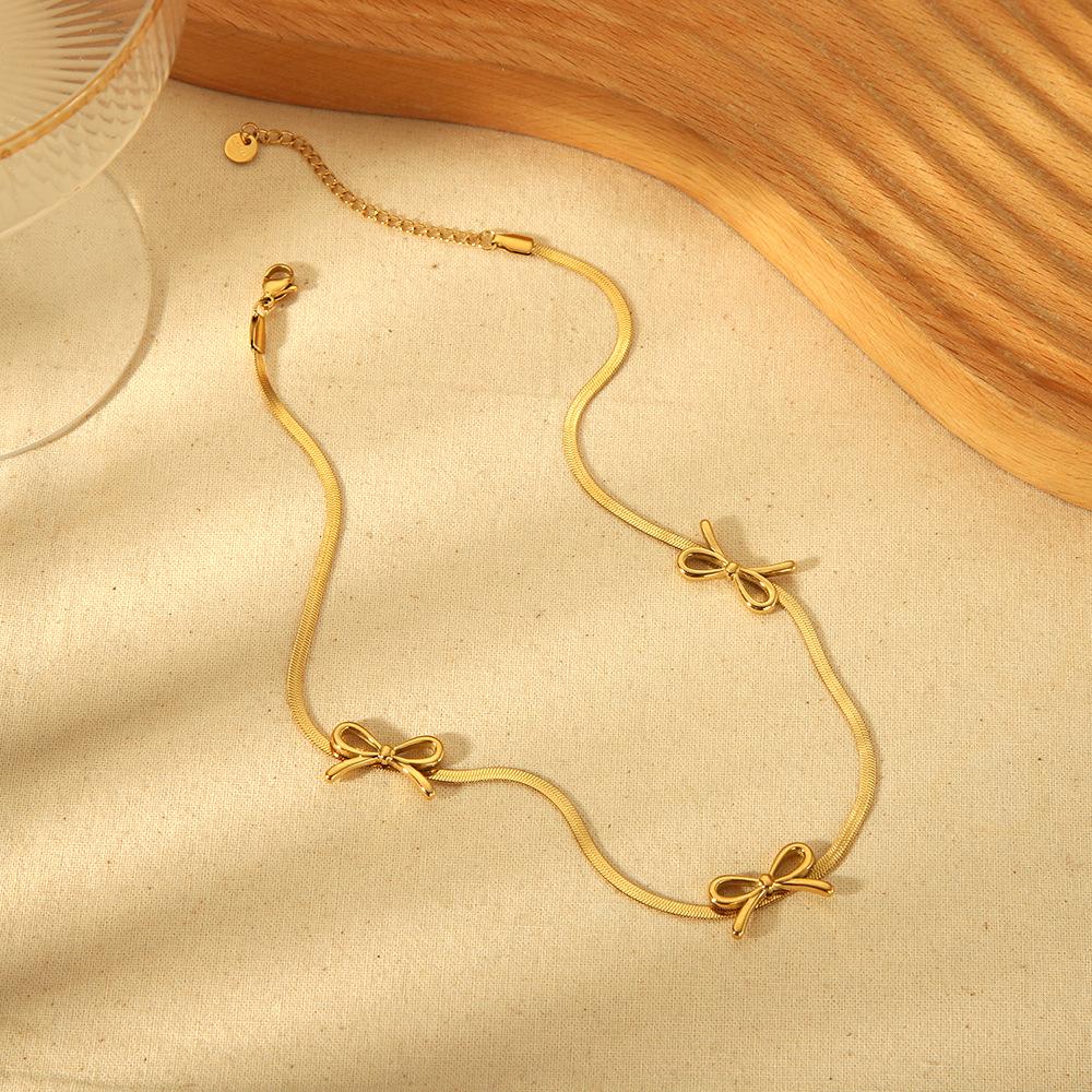European and American Ins Fashion Light Luxury Hollow Bow Pendant Necklace Plated with 18k Gold Stainless Steel Waterproof Flat Snake Chain Jewelry