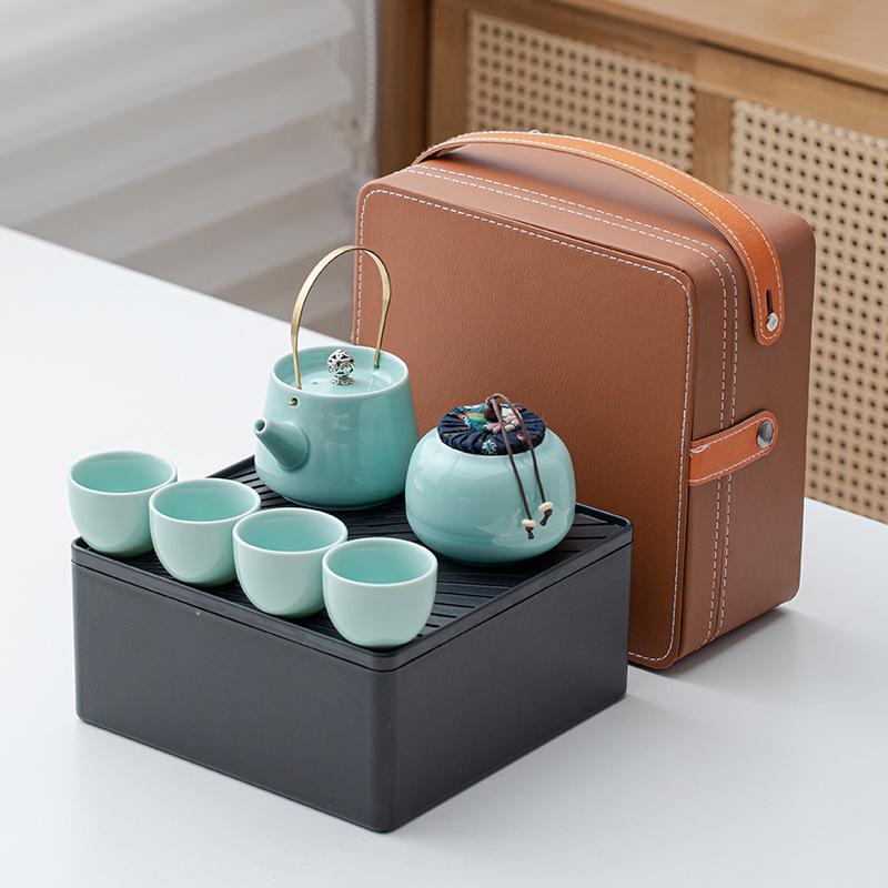 Portable Ceramic Kung Fu Tea Set: Teapot with Handle and Four Cups for Travel and Business Gifting