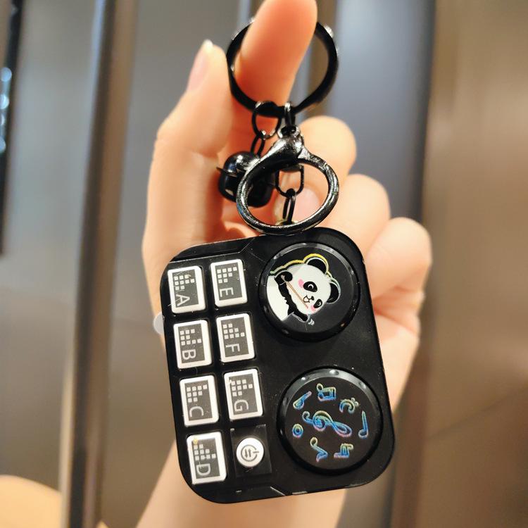 Leuchtender Mini-DJ-Mixer Schlüsselanhänger: Cartoon Musik-Spielkonsolen-Anhänger