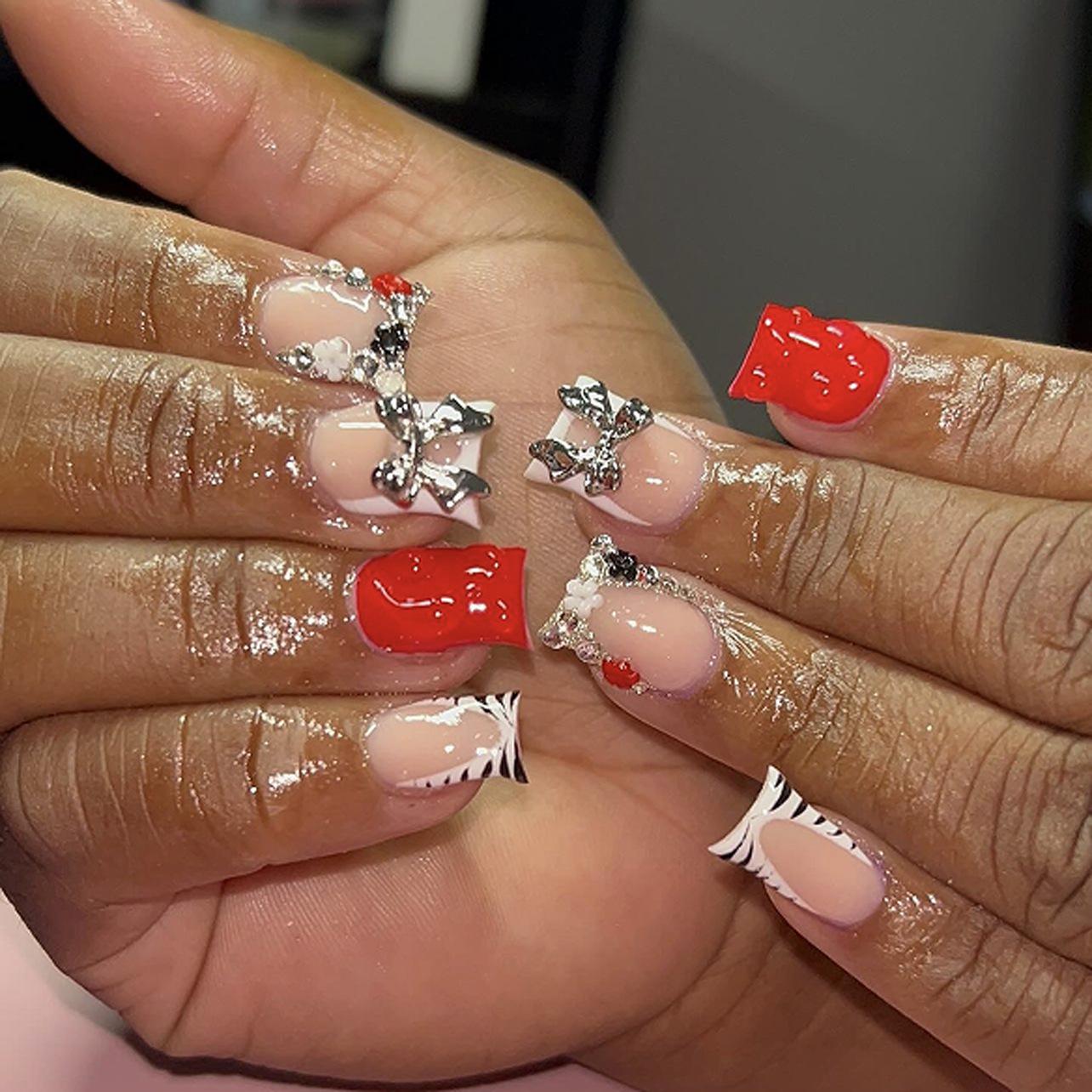 French black and white zebra pattern nail art piece point diamond metal bow wearing nail 3D red square wearing nail piece