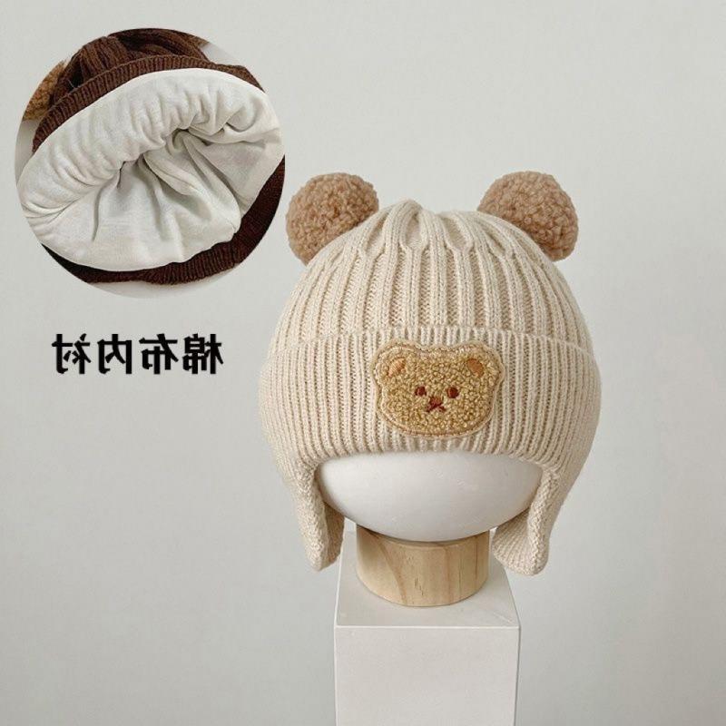Kinderhüte Herbst und Winter Jungen niedlich super niedlich gestrickte Wollmütze Mädchen winddichte Ohrenschützer Baby verdickte warme Mütze