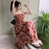 Seaside vacation floral suspender dress women's summer 2026 new Hong Kong style retro chic small man long skirt