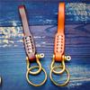 Braided Vegetable-Tanned Cowhide Keychain with Brass and Copper Horseshoe Buckle