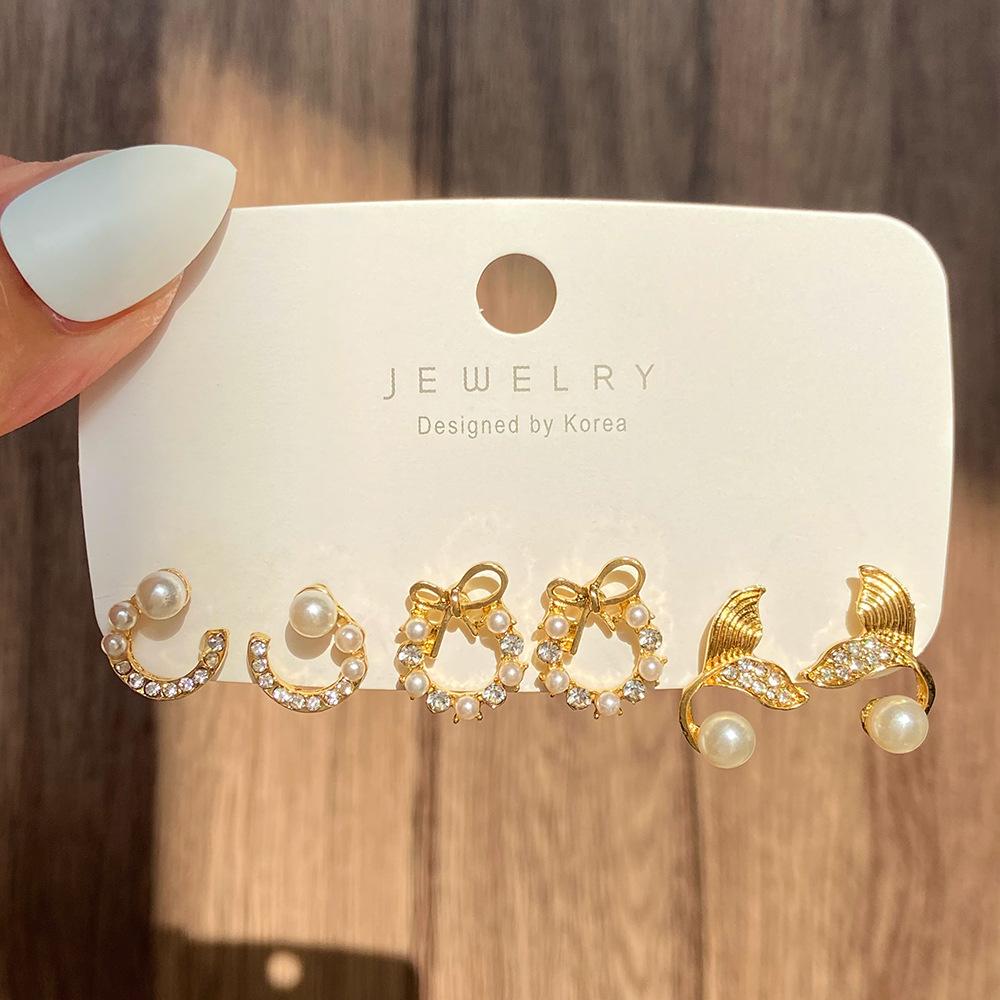 

Новые серьги-пусеты в виде банта, рыбьего хвоста, жемчуга и луны с бриллиантами, модный темпераментный геометрический набор серег