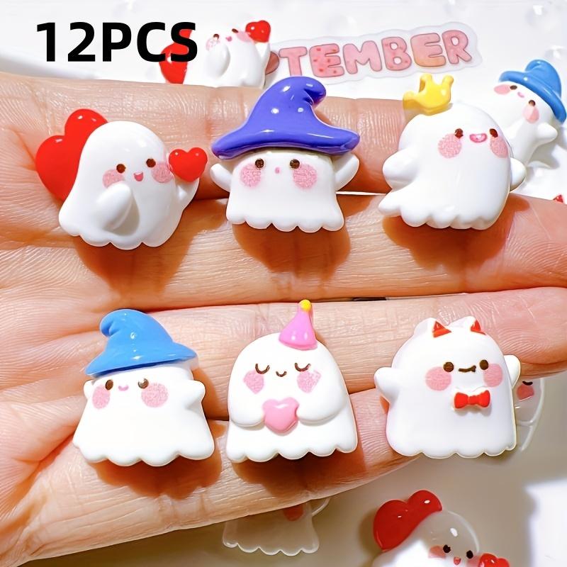 A pack of 12 adorable Halloween ghost resin accessories for DIY hair clips and decorations, including shoe buckles, hat patches,