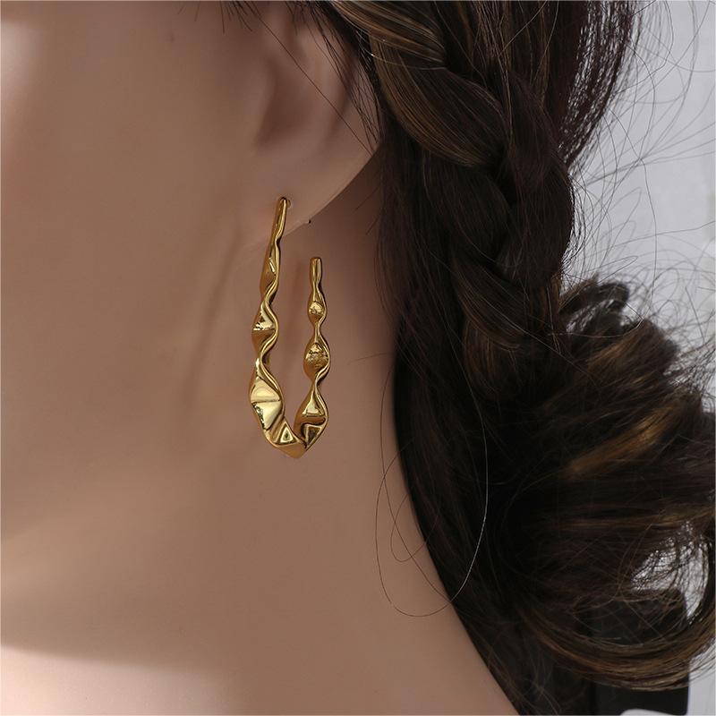 Einfache und kalte Ohrstecker im Retro-Wellen-Stil, Nischendesign, lange Quasten-Kupferohrringe