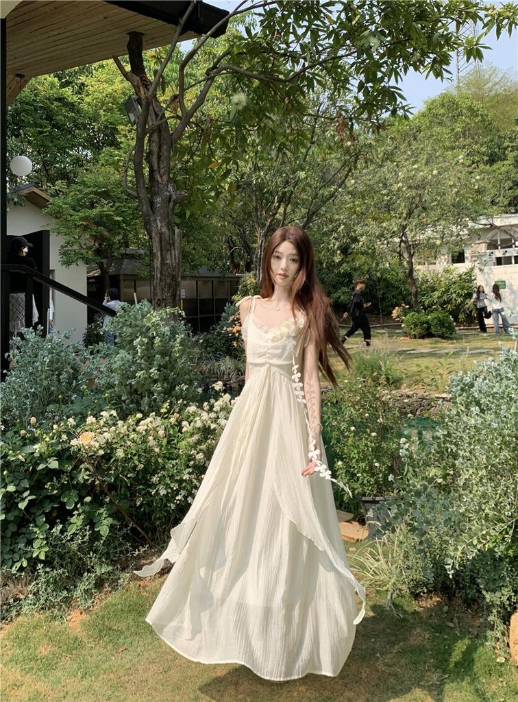 Holiday style flower design suspender dress women's 2026 summer new waist thin very fairy long skirt