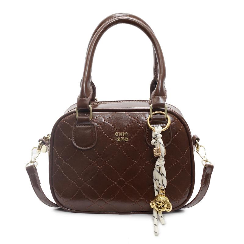 

Premium texture simple commuter handbag fashionable retro simple messenger bag 2025 new casual bowling bag no pendant темно-коричневого