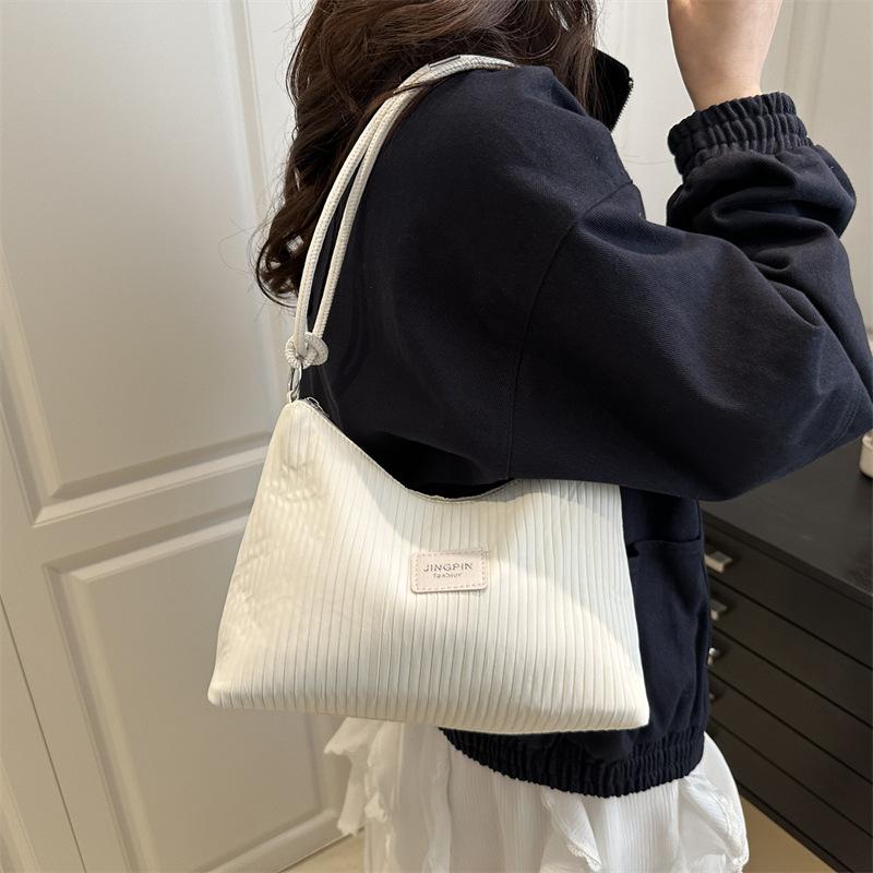 2025 Casual Large-capacity Indentation Stripes Fresh New Summer Foreign Style Commuting Solid Color Shoulder Underarm Handbag