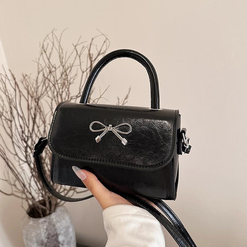 2025 simple solid color bow sewing line less fashionable casual oblique span single shoulder portable small square women's bag