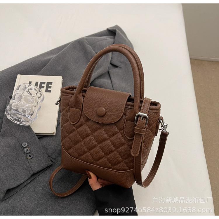 

Handbag bag women s commuter winter new high-end sense simple trend shoulder bag Korean versatile explosive bucket bag темно-коричневого