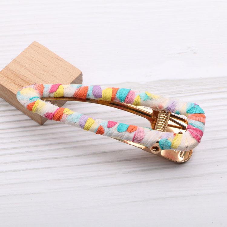 Красочный ободок с кроличьими ушками в горошек и заколкой-бантом.