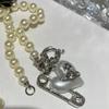 Empress Dowager Vivian: 2023 Autumn Hot Style Pearl Necklace with Heart Buckle Brooch for Women