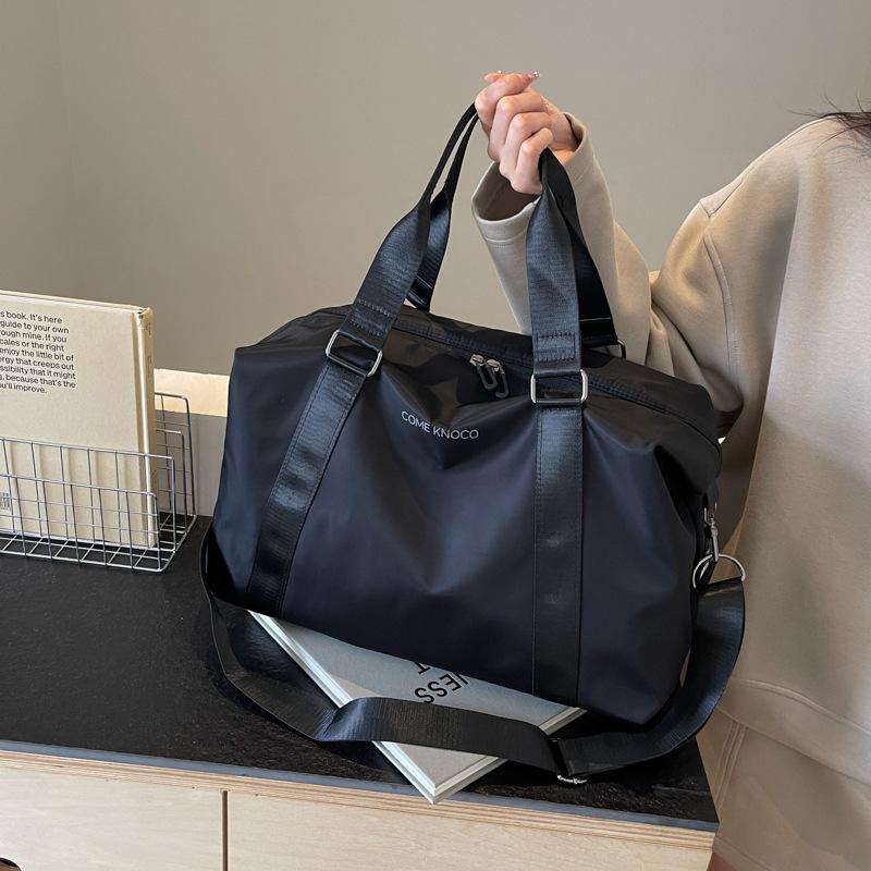 Korean version of fashion short-distance travel bag women's shoulder carry large-capacity luggage travel business travel bag men