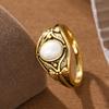 Retro luxurious engraved lotus-shaped copper ladies' ring, set with oval artificial gemstones, suitable for daily and date wear.