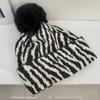 Zebra pattern hairball knitted hat women's autumn and winter retro versatile face small wool hat cold-proof warm ear hat