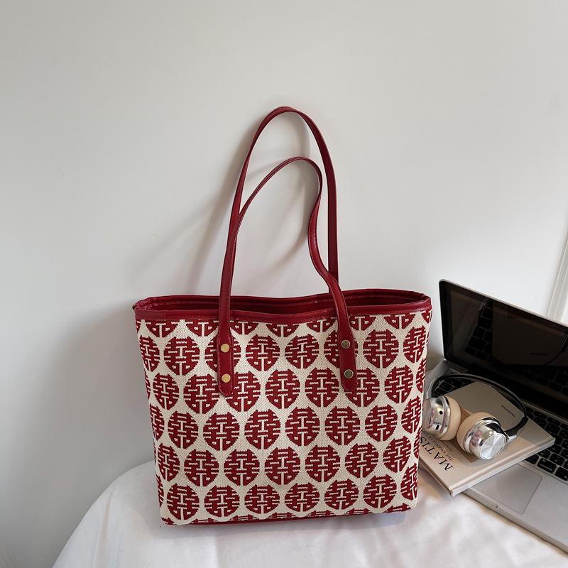 

Red high-value fashion festive tote bag women s 2025 autumn new niche festive simple shoulder bag women