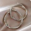 Fashionable and simple round twisted irregular ladies earrings exaggerated girls earrings high-grade plain hoop earrings