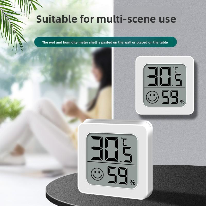 

Indoor Home Office LCD Mini Smiley Face Temperature and Humidity Thermometer white
