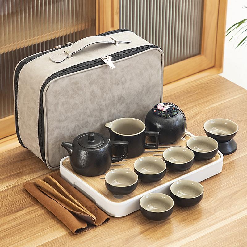 Black pottery travel kung fu tea set portable business gift set creative ceramic cooling pot set