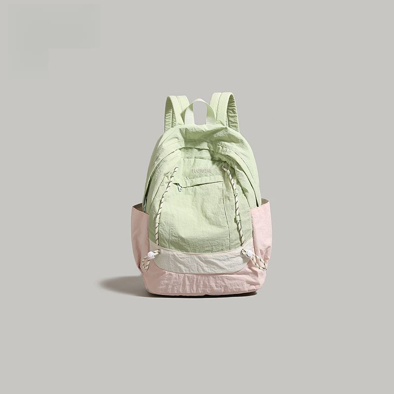 

2025 new contrasting color splicing women s light and versatile commuting fashion high school schoolbag large capacity backpack