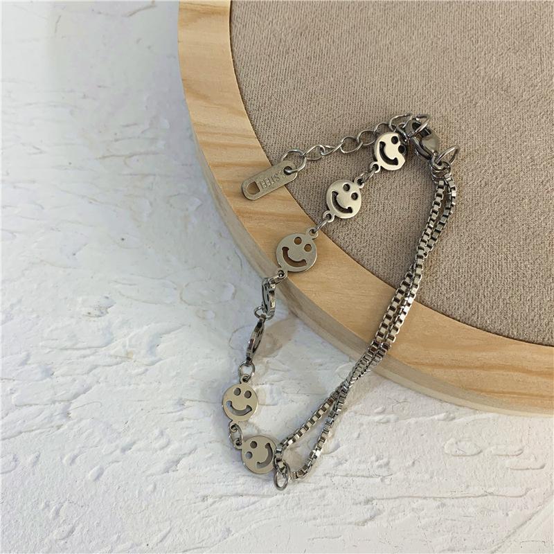 

Комплект из ожерелья и браслета из титановой стали с корейским смайликом