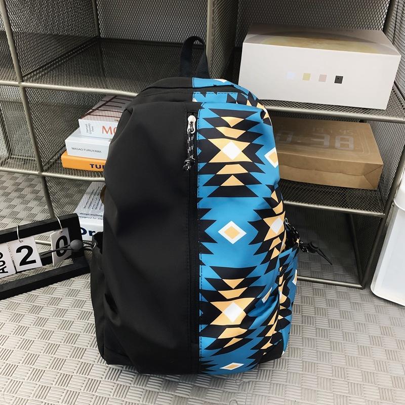 

Шкільний сезон рюкзак графіті сумка коміксів чоловіків і жінок середньої школи студенти відпочинку подорожі чоловіки і жінки модний рюкзак single package синій