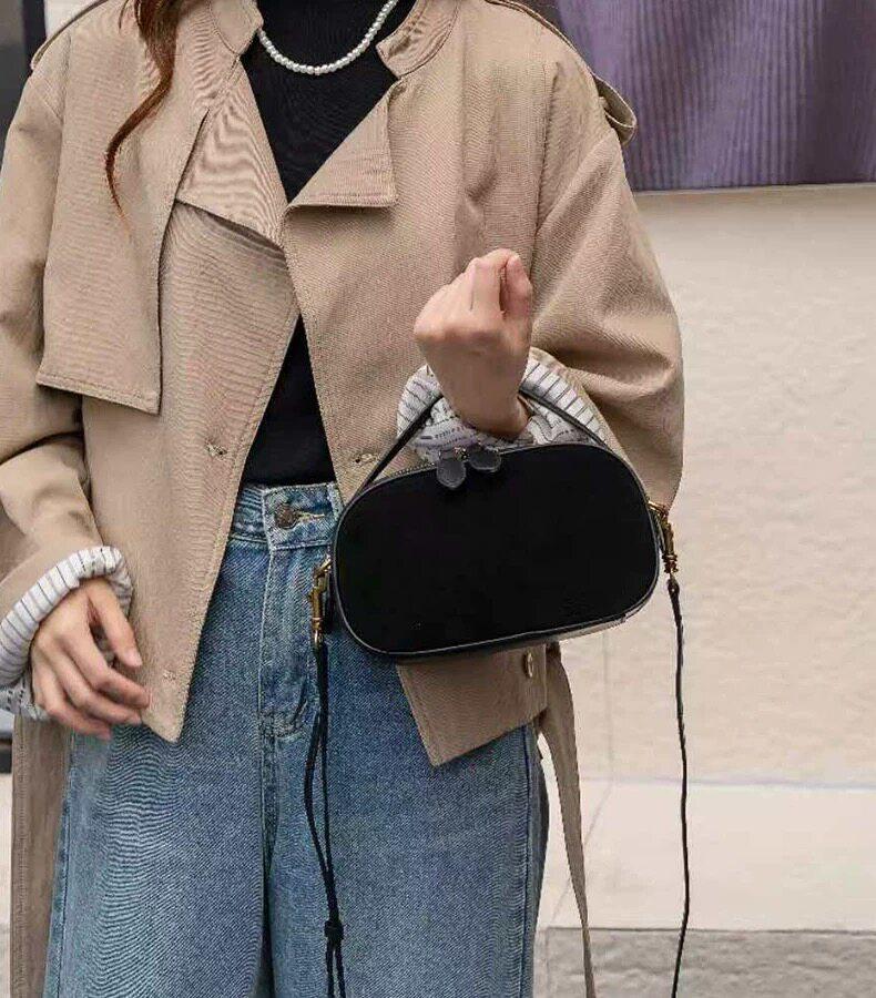 Mini handbagnew autumn/winter stylecrossbody baghand-heldfashionable cowhide leatherversatilegenuine leather retro women's bag.