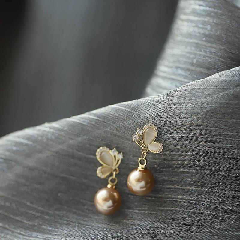 

French light luxury spring high-end champagne imitation pearl stud earrings femininity butterfly earrings new explosion